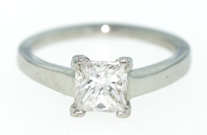 Platinum 1.04ct Princess Cut Diamond Solitaire Ring WBS: Platinum 1.04ct Princess Cut Diamond Solitaire Ring WBS107. Good Condition! SC1051QT. One electronicallyt ested platinum ladies cast diamond solitaire rin with a bright polish finish. Identified with 