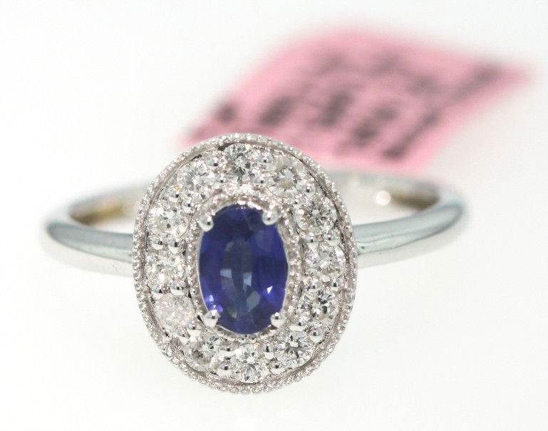 14KT White Gold .56ct Sapphire and Diamond Ring FJM441: 14KT White Gold .56ct Sapphire and Diamond Ring FJM441. Excellent Condition! XS163WN. 14KT white gold sapphire and diamond ring. Features one sapphire weighing 0.56cts and round diamonds weighing a to
