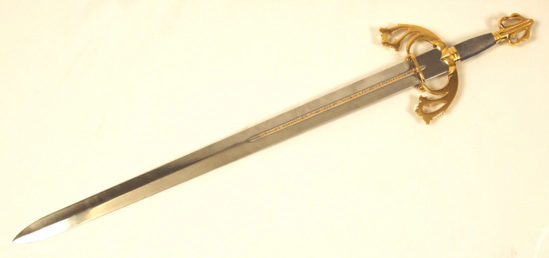 Vintage El Cid Tizona Sword WBL39: "Vintage El Cid Tizona Sword WBL39. Very Good Condition! MU101AN. The El Cid Tizona Sword has a double-edged steel blade. The hilt is of gold tone plated cast metal with downward curved quillons enlar