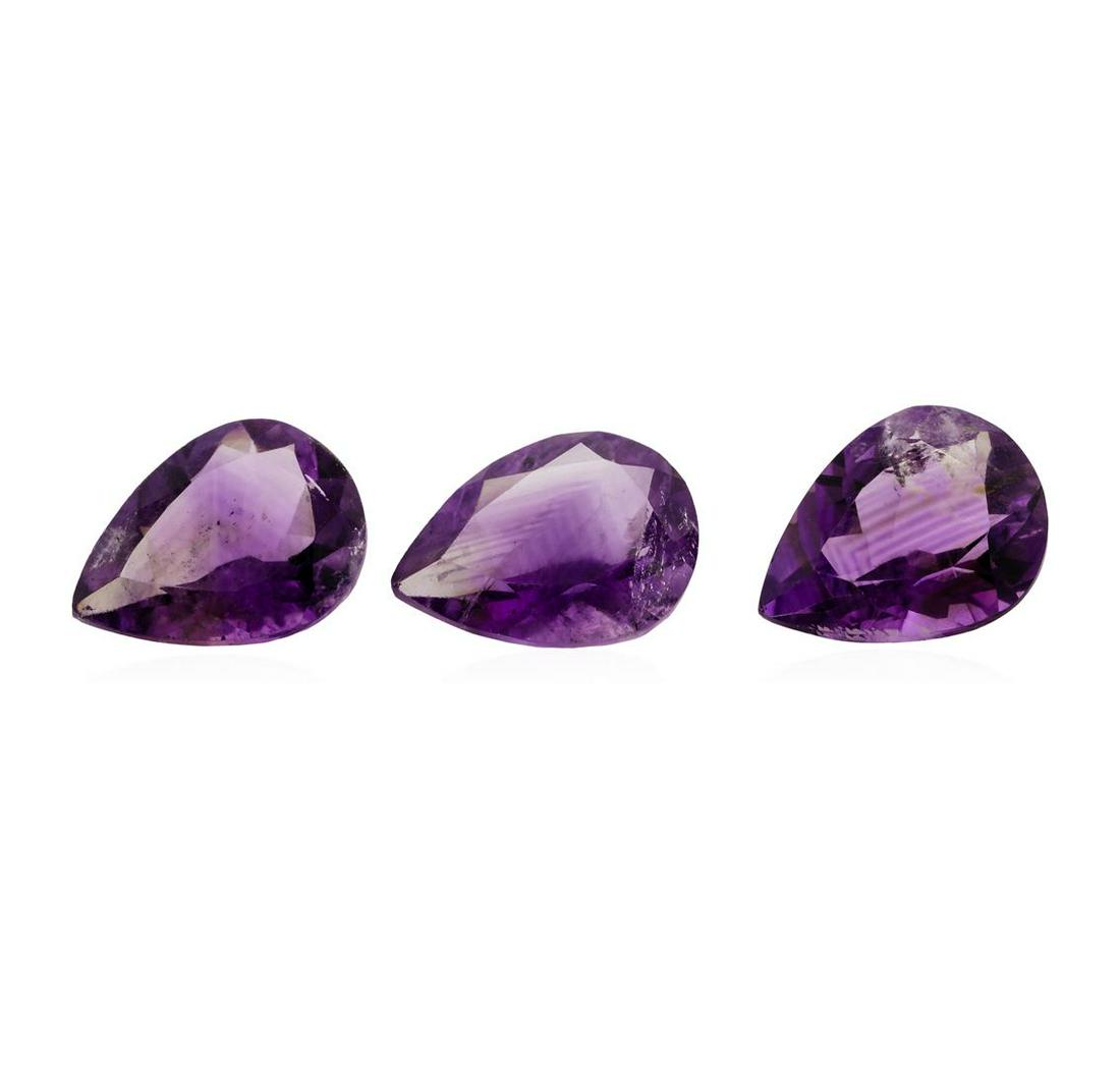 20.56 ctw.Natural Pear Cut Amethyst Parcel of Three: One natural pear cut amethyst parcel of three with an exact weight of 20.56ctw., clarity is moderately included, v.s. brownish purple, medium to medium light. Gemological Appraisals Services estimates