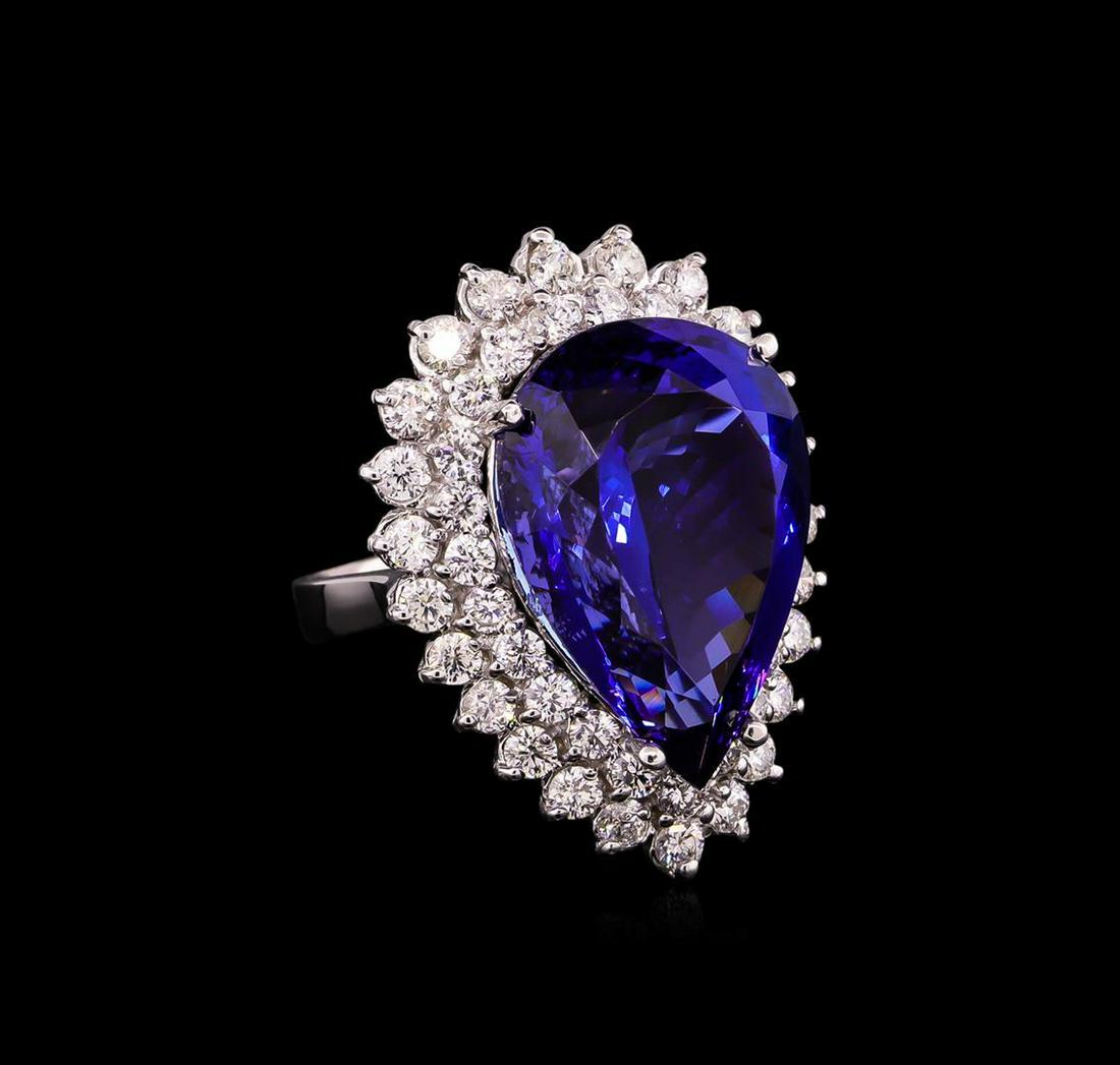 14KT White Gold GIA Certified 24.90 ctw Tanzanite and Diamond Ring: One electronically tested 14KT white gold ladies cast tanzanite and diamond ring with a bright polish finish. Condition is new, good workmanship. The featured tanzanite is set within two tiered diamon