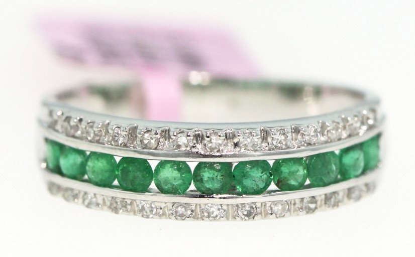 14KT White Gold .59ct Emerald and .16ct Diamond Ring FJ: 14KT White Gold .59ct Emerald and .16ct Diamond Ring FJM484. Excellent Condition! GC122WH. One 14KT white gold emerald and diamond ring. Features 11 emeralds weighing a total of 0.59cts surrounded by 