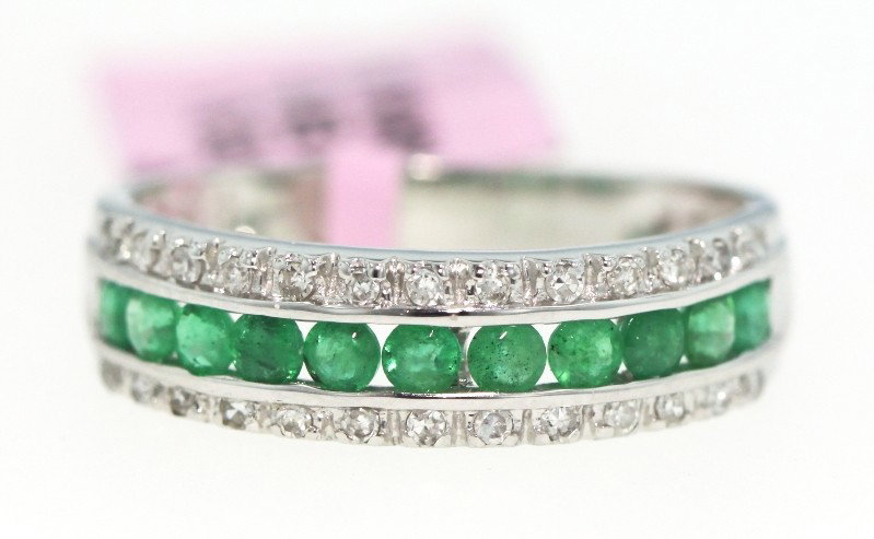 14KT White Gold .59ct Emerald and .16ct Diamond Ring FJ: "14KT White Gold .59ct Emerald and .16ct Diamond Ring FJM483. Excellent Condition! XJ122PT. One 14KT white gold emerald and diamond ring. Features 11 emeralds weighing a total of 0.59cts surrounded by