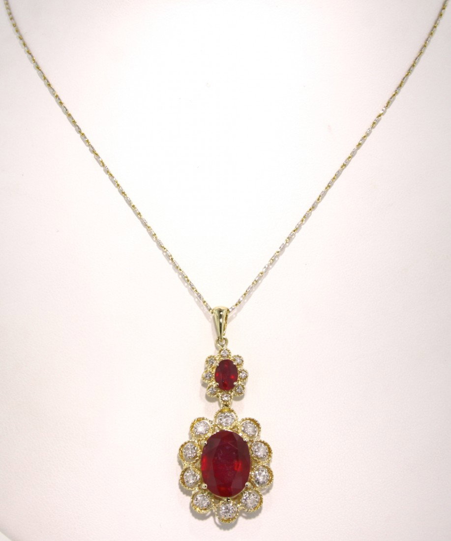 14KT Yellow Gold 11.17ct Ruby and Diamond Pendant and C: "14KT Yellow Gold 11.17ct Ruby and Diamond Pendant and Chain RM248. New Condition! TG8511VC. One lady's polished, stamped and electronically tested solid 14KT yellow gold pendant mounted with: 2 genui