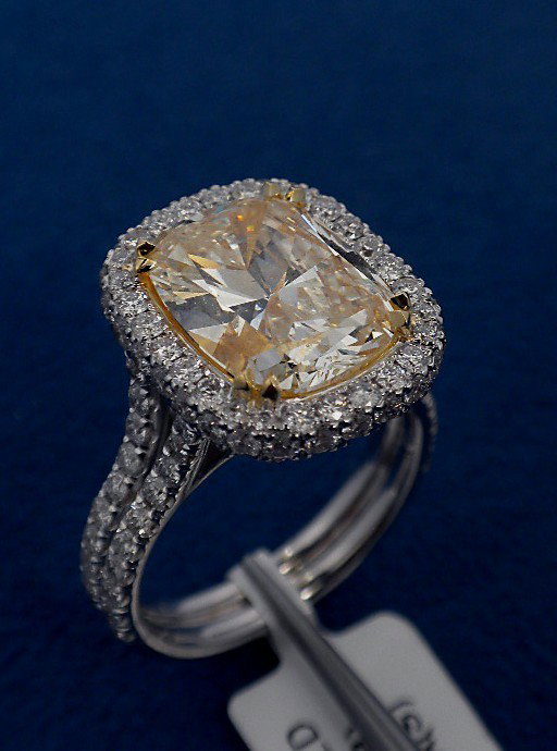 18KT White Gold 6.27ct Yellow and White Diamond Ring A3: "18KT White Gold 6.27ct Yellow and White Diamond Ring A3549. New Condition! UD10191MK. One electronically tested 18KT white gold ladies cast diamond ring. Good workmanship. The featured diamond is set