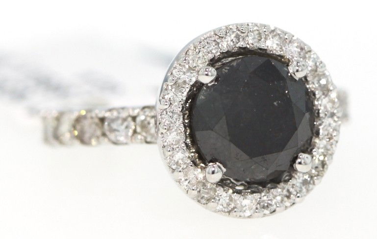 14KT White Gold 3.96ct Black and White Diamond Ring RM2: "14KT White Gold 3.96ct Black and White Diamond Ring RM201. New Condition! TH659EI. One lady's polished, stamped and electronically tested solid 14KT white gold ring mounted with 1 genuine round black