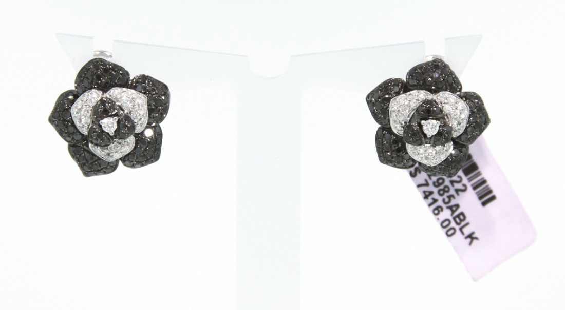 14KT White Gold 1.83ct Black and White Diamond Flower E: 14KT White Gold 1.83ct Black and White Diamond Flower Earrings FJM624. Excellent Condition! ZL247VS. One 14KT white gold Michael Christoff black and white diamond flower earrings with a French clip ba