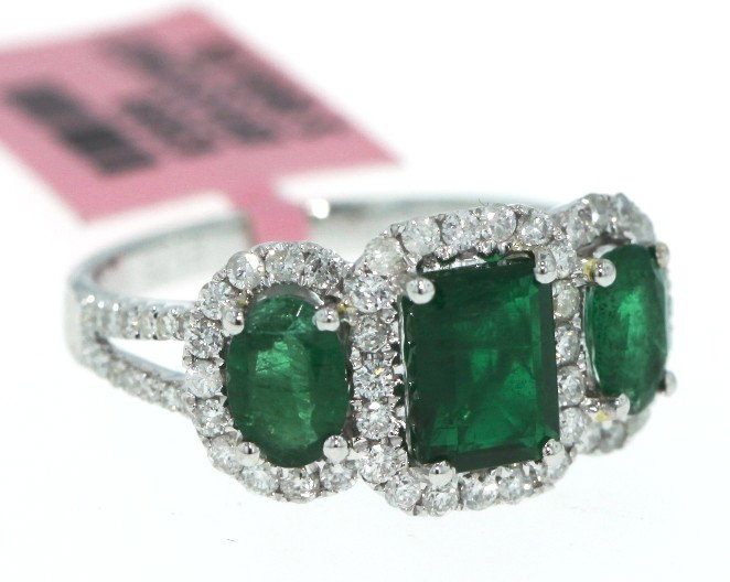 18KT White Gold 1.73ct Emerald Trio and Diamond Ring FJ: 18KT White Gold 1.73ct Emerald Trio and Diamond Ring FJM768. Excellent Condition! BY198SW. One 18KT white gold Michael Christoff emerald trio and diamond ring. Features 3 emeralds weighing a total of 