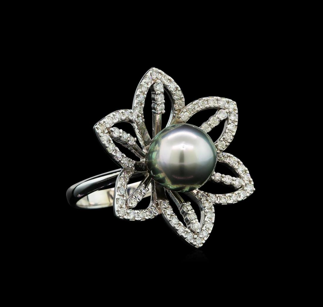 Pearl and Diamond Ring - 14KT White Gold: One electronically tested 14KT white gold lady's cast flower design ring with a bright polish finish. The featured lady's ring has a shank measuring 2.81 millimeters wide. Identified with markings of 