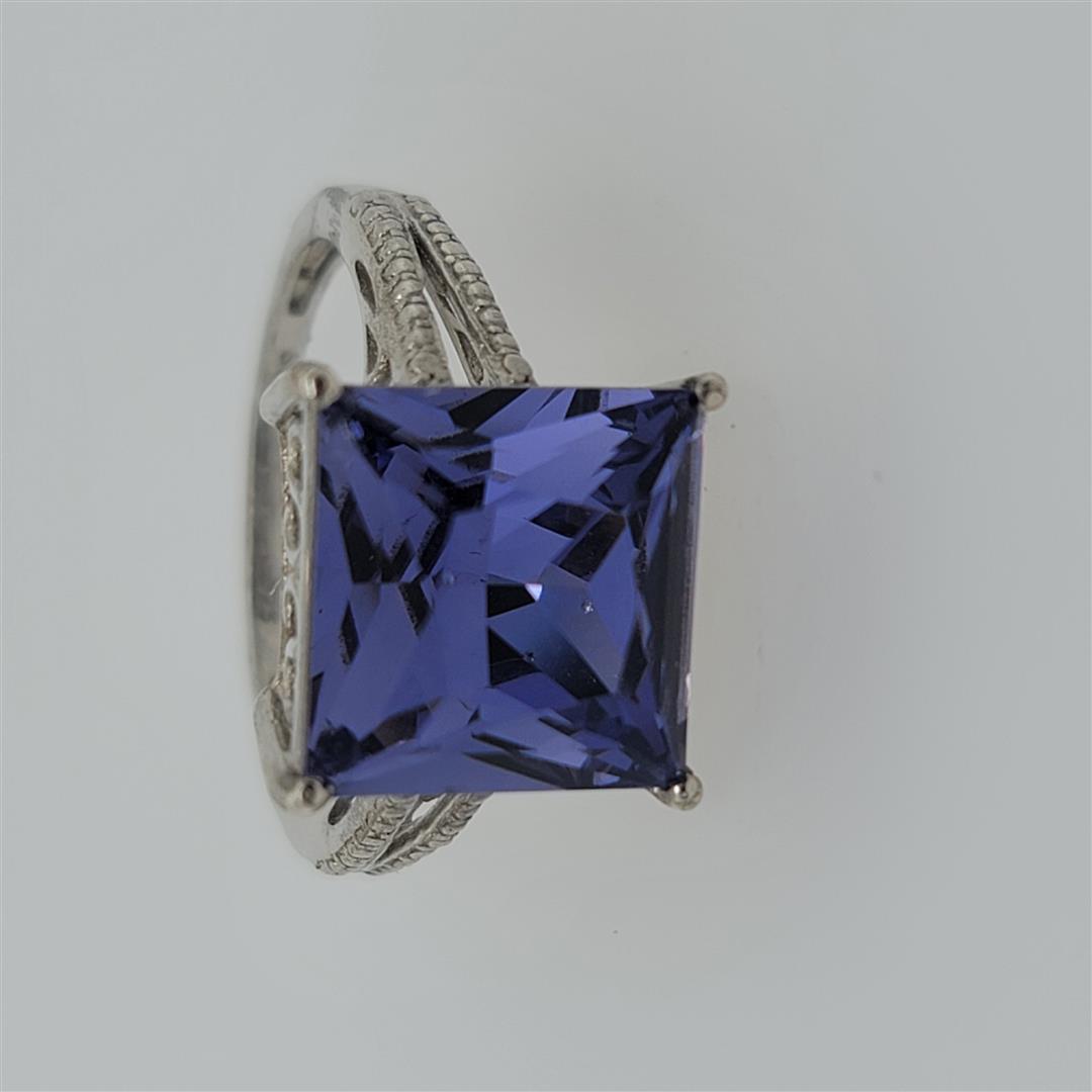 Sterling Silver Ring: One Sterling Silver Ring. The ring size is 9. Contains semiprecious stones.