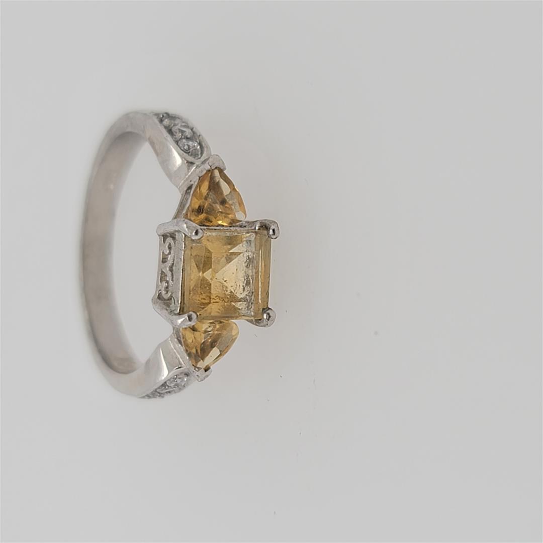Sterling Silver Ring: One Sterling Silver Ring. The ring size is 7. Contains semiprecious stones.