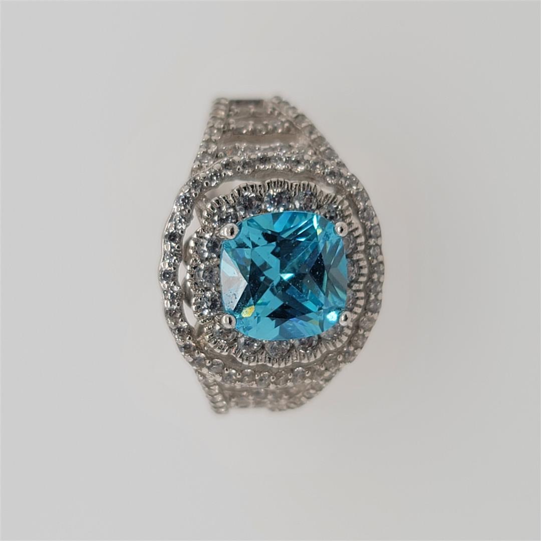 Sterling Silver Ring: One Sterling Silver Ring. The ring size is 8.5. Contains semiprecious stones.