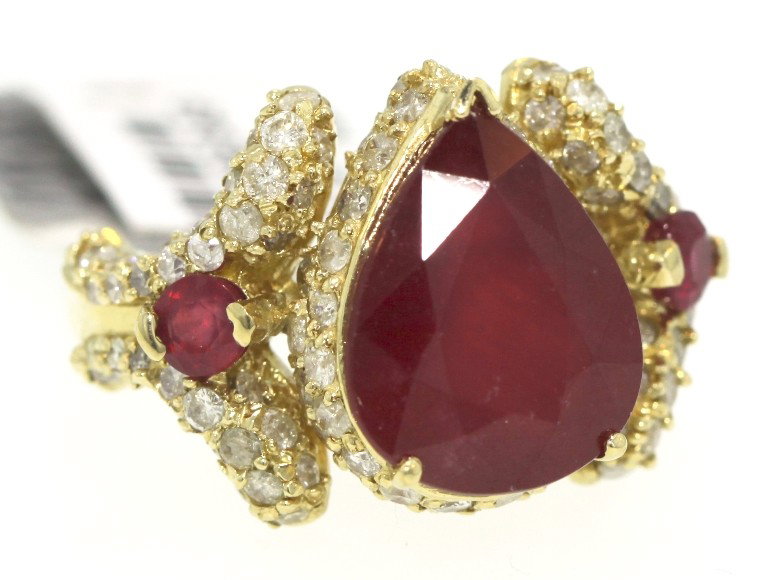 14KT Yellow Gold 9.36ct Ruby and Diamond Ring RM269: 14KT Yellow Gold 9.36ct Ruby and Diamond Ring RM269. Great Condition! AV198QR. One lady's polished, stamped and electronically tested solid 14KT yellow gold ring mounted with: 1 pear shaped genuine ru