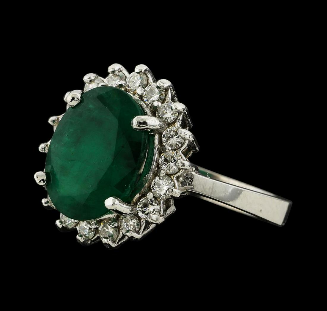 3.75 ctw Emerald and Diamond Ring - 14KT White Gold: One electronically tested 14KT white gold lady's cast fashion ring with a basket halo with a bright polish finish. The featured lady's ring has a shank measuring 2.60 millimeters wide. Identified with