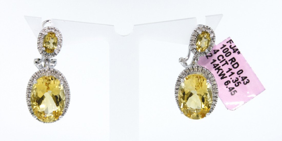 14KT White Gold 11.35ct Citrine and Diamond Earrings FJ: 14KT White Gold 11.35ct Citrine and Diamond Earrings FJM636. Excellent Condition! US715DA. One 14KT white gold citrine and diamond drop earrings. The pair of earrings feature 4 oval cut citrines weigh