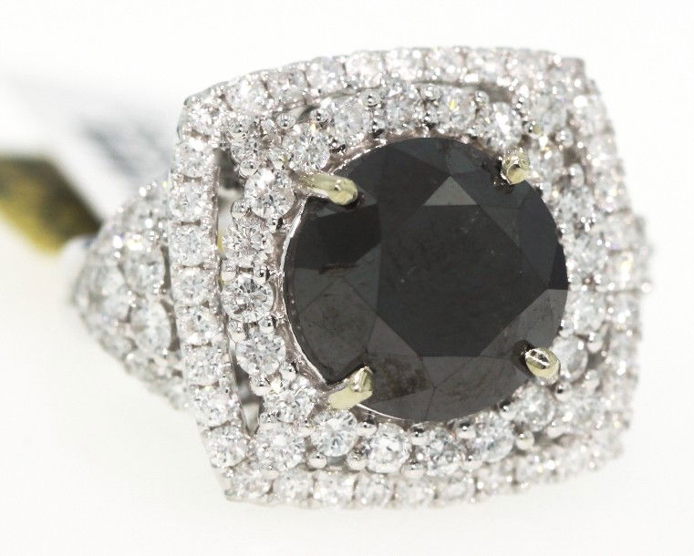 14KT White Gold 10.11ct Black and White Diamond Ring RM: 14KT White Gold 10.11ct Black and White Diamond Ring RM264. New Condition! PW1513MS. One electronically tested 14KT white gold ladies cast black and white diamond ring with a bright finish. Good workm