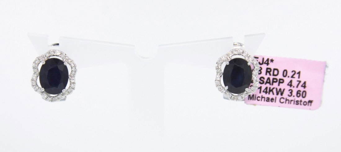 14KT White Gold 4.74ct Sapphire and Diamond Earrings FJ: 14KT White Gold 4.74ct Sapphire and Diamond Earrings FJM343. Excellent Condition! TH456BQ. One pair of 14KT white gold sapphire and diamond Michael Christoff earrings. The pair of earrings features 2 