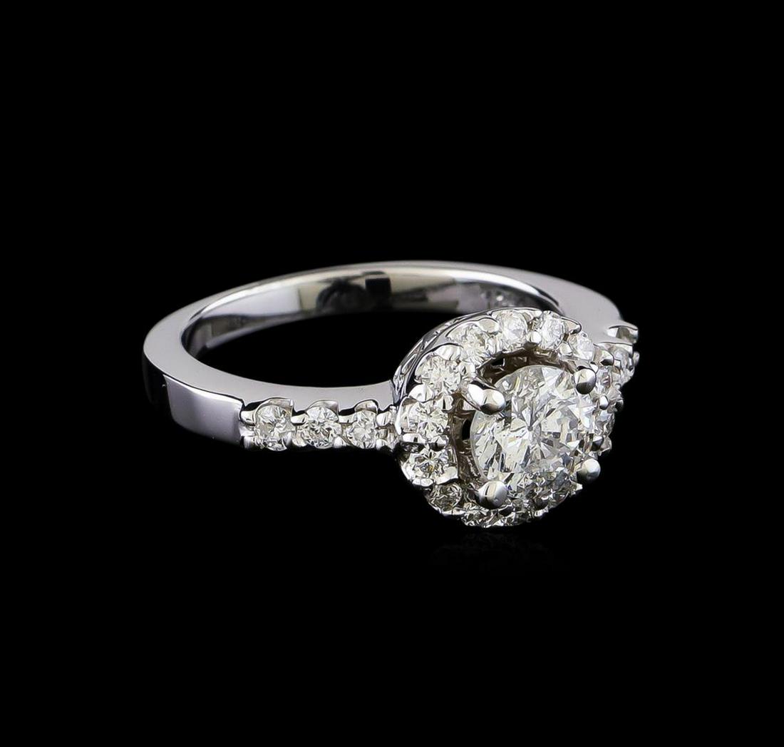 1.10 ctw Diamond Ring - 14KT White Gold: One electronically tested 14KT white gold lady's cast wedding ring with a basket halo with a bright polish finish. The featured lady's ring has a shank measuring 2.26 millimeters in width. Identified