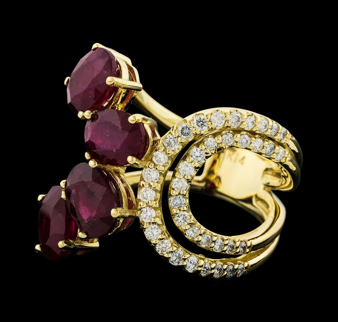 4.73 ctw Ruby and Diamond Ring - 14KT Yellow Gold: One Ruby and Diamond Ring featuring: 14KT Yellow Gold with a total weight of 6.73 grams, Four Ruby stones with a total weight of 4.73ctw, and 49 Diamonds with a total weight of 0.50 ctw.