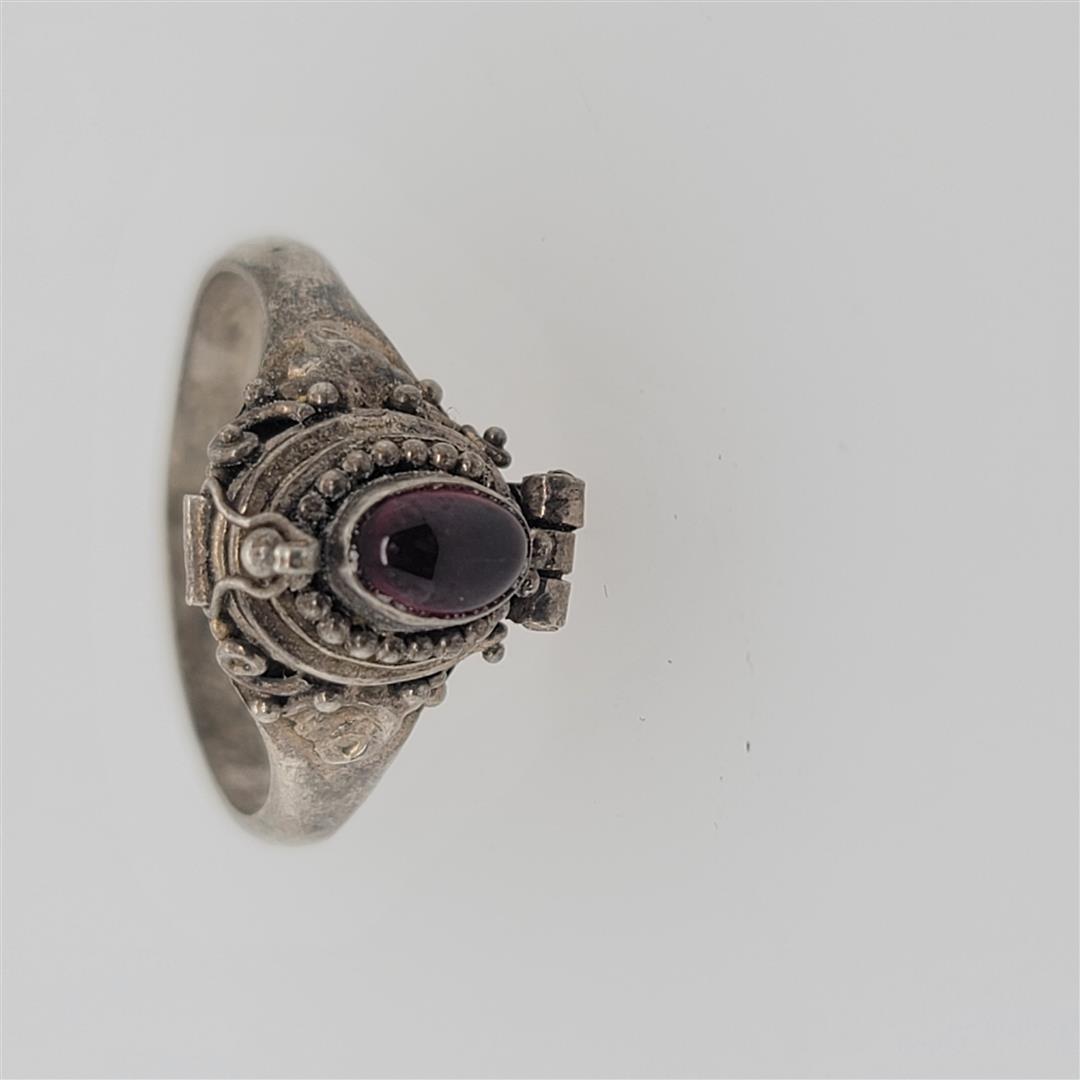 Sterling Silver Ring: One Sterling Silver Ring. The ring size is 7.75. Contains semiprecious stones.