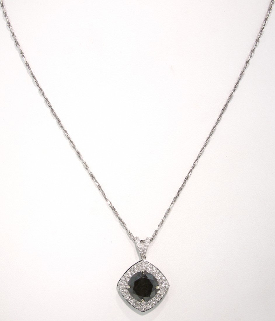 14KT White Gold 7.07ct Black and White Diamond Pendant : "14KT White Gold 7.07ct Black and White Diamond Pendant and Chain RM230. New Condition! BR4861UK. One electronically tested 14KT white gold ladies cast and assembled black and white diamond pendant wi