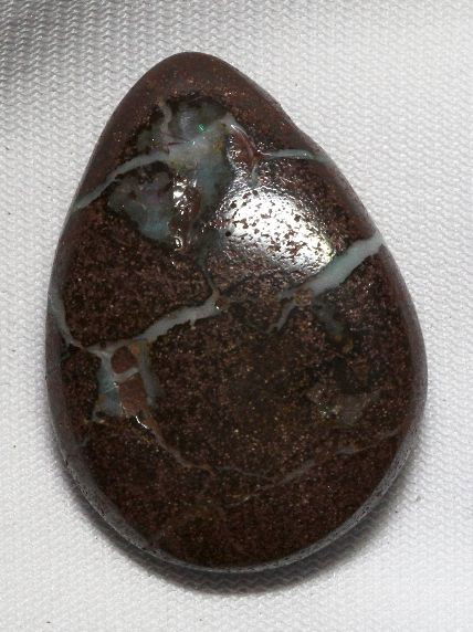 Boulder Opal (58.81ct.) BO128: Boulder Opal (58.81ct.) BO128. Excellent Condition! ZQ4BG. One Boulder Opal pendant weighing 58.81ctw. Thank you for viewing this lot. We are always adding new inventory and new auctions, so check bac