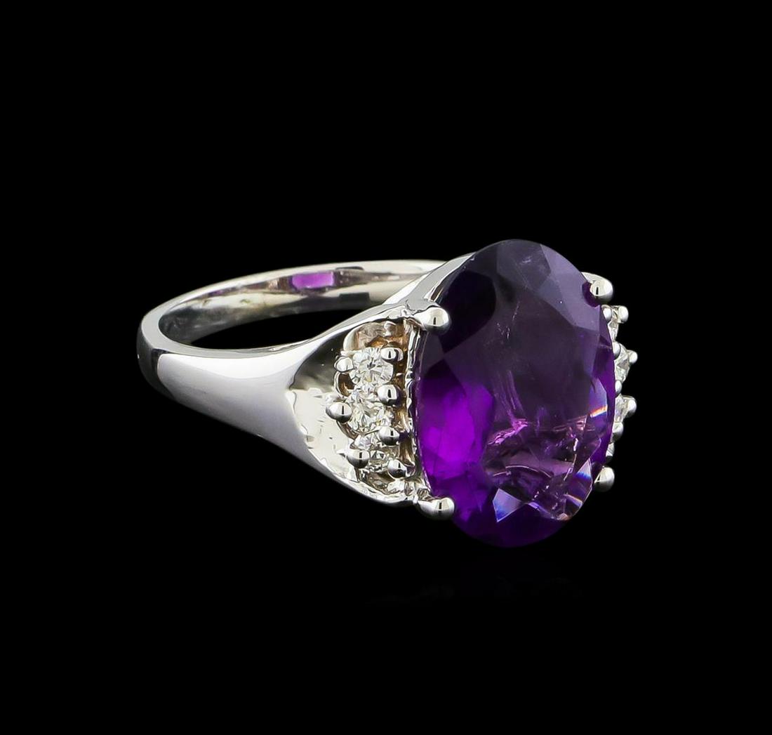 4.13 ctw Amethyst and Diamond Ring - 14KT White Gold: One Ring featuring: 14KT White Gold weighing 4.34 grams containing one Amethyst center stone with a total weight of 4.13ct and Diamonds with a total weight of 0.16ct.