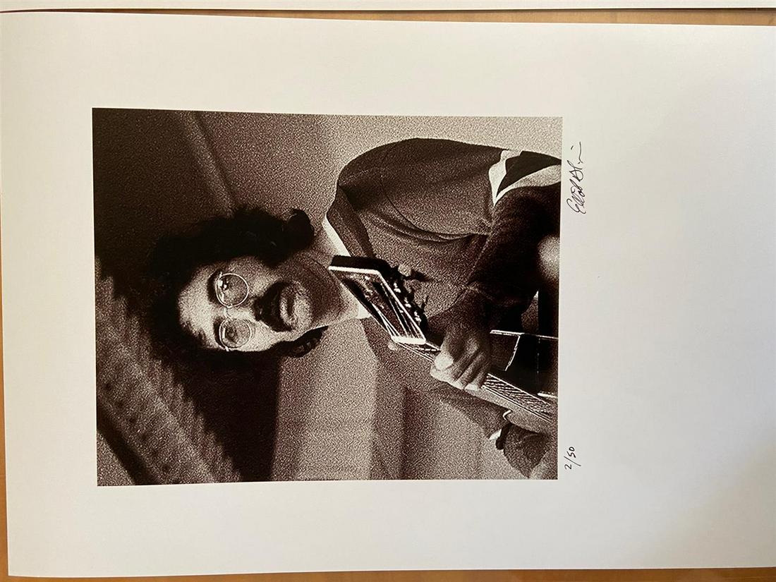 Jerry Garcia, close-up by Elliot Blinder: A hand-signed & numbered glossy photograph shot in 1969 for Rolling Stone by photographer/author Elliot Blinder. Image is 10x8" on 18x12" paper. Shot backstage at The Boston Tea Party club. Edition of