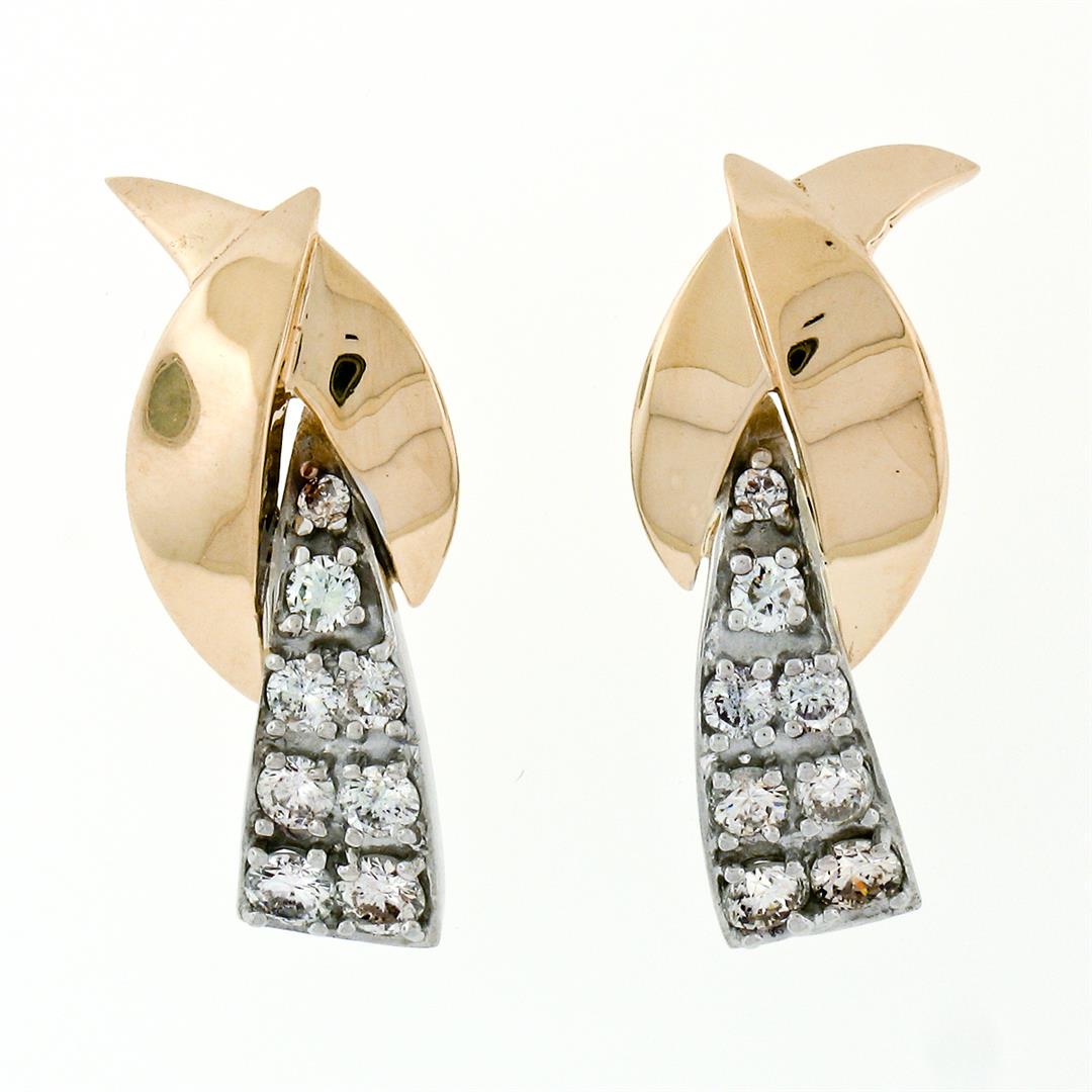 Vintage 14k Yellow & White Gold 1.00 ctw 16 Round Diamond Waterfall Drop Earring: A vintage solid 14k yellow and white gold waterfall drop earrings, with 16 round brilliant cut natural diamonds (G/H- VS2/SI1; 1.00ctw). The earrings measure approximately 26.56x10.51mm and weigh a to