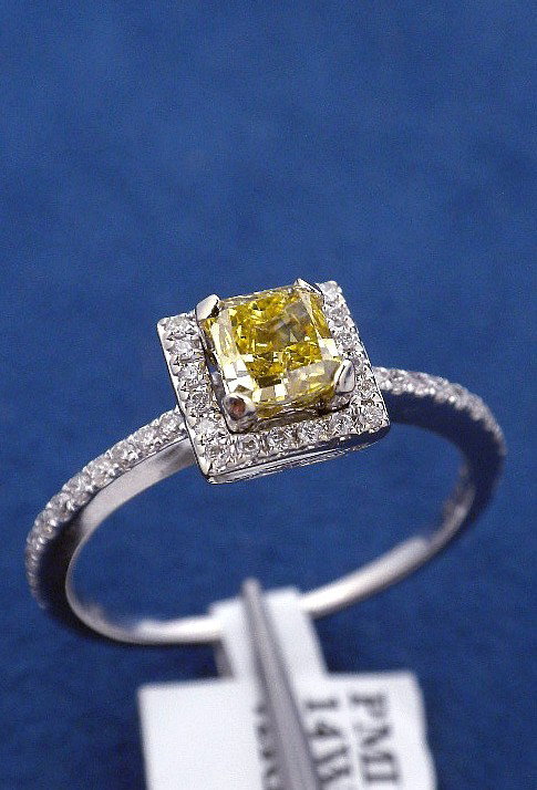 14KT White Gold .65ct Yellow and White Diamond Ring J31: 14KT White Gold .65ct Yellow and White Diamond Ring J31. New Condition! YJ328VM. One electronically tested 14KT white gold ladies cast diamond ring. Good workmanship. The featured diamond is set withi