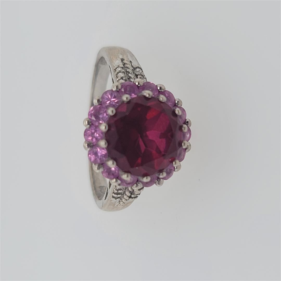 Sterling Silver Ring: One Sterling Silver Ring. The ring size is 10.25. Contains semiprecious stones.