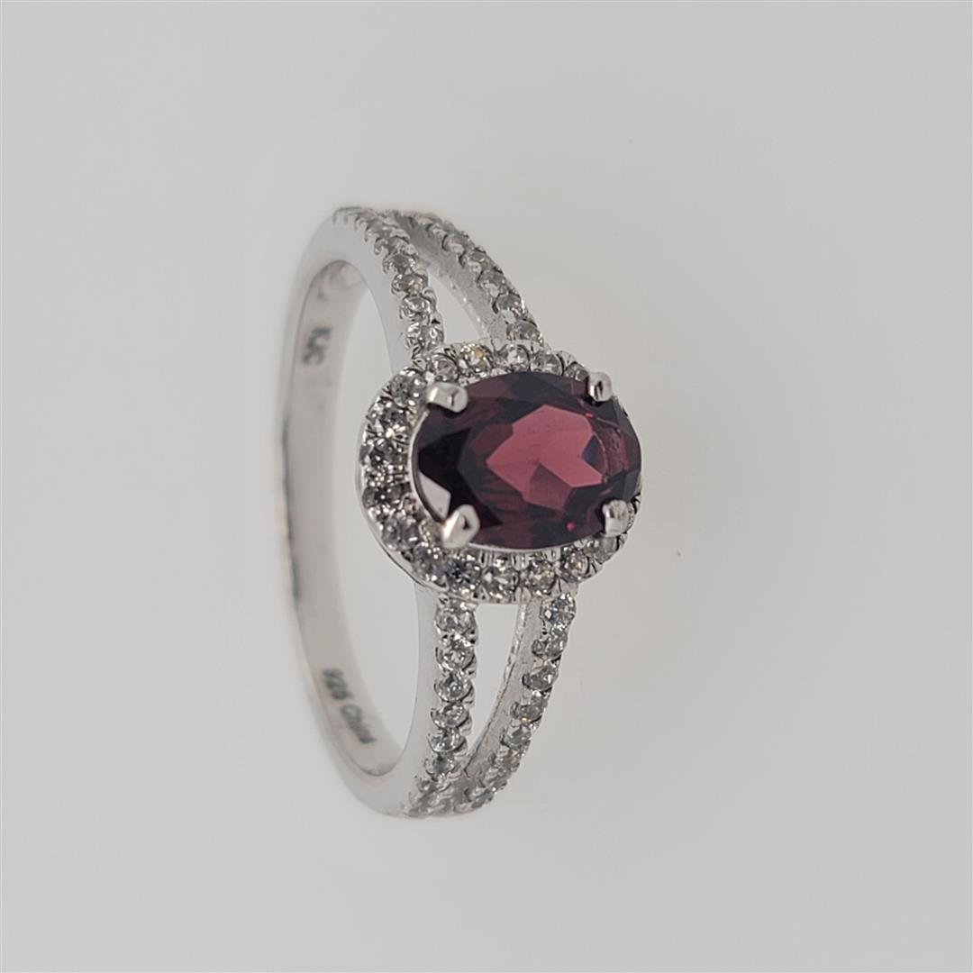 Sterling Silver Ring: One Sterling Silver Ring. The ring size is 9. Contains semiprecious stones.