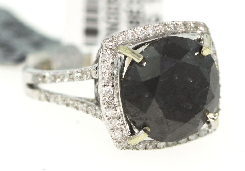 14KT White Gold 10.5ct Black and White Diamond Ring RM3: "14KT White Gold 10.5ct Black and White Diamond Ring RM348. Good Condition! XH2371PN. One electronically tested 14KT white gold ladies cast black and white diamond ring. Good workmanship. The featured