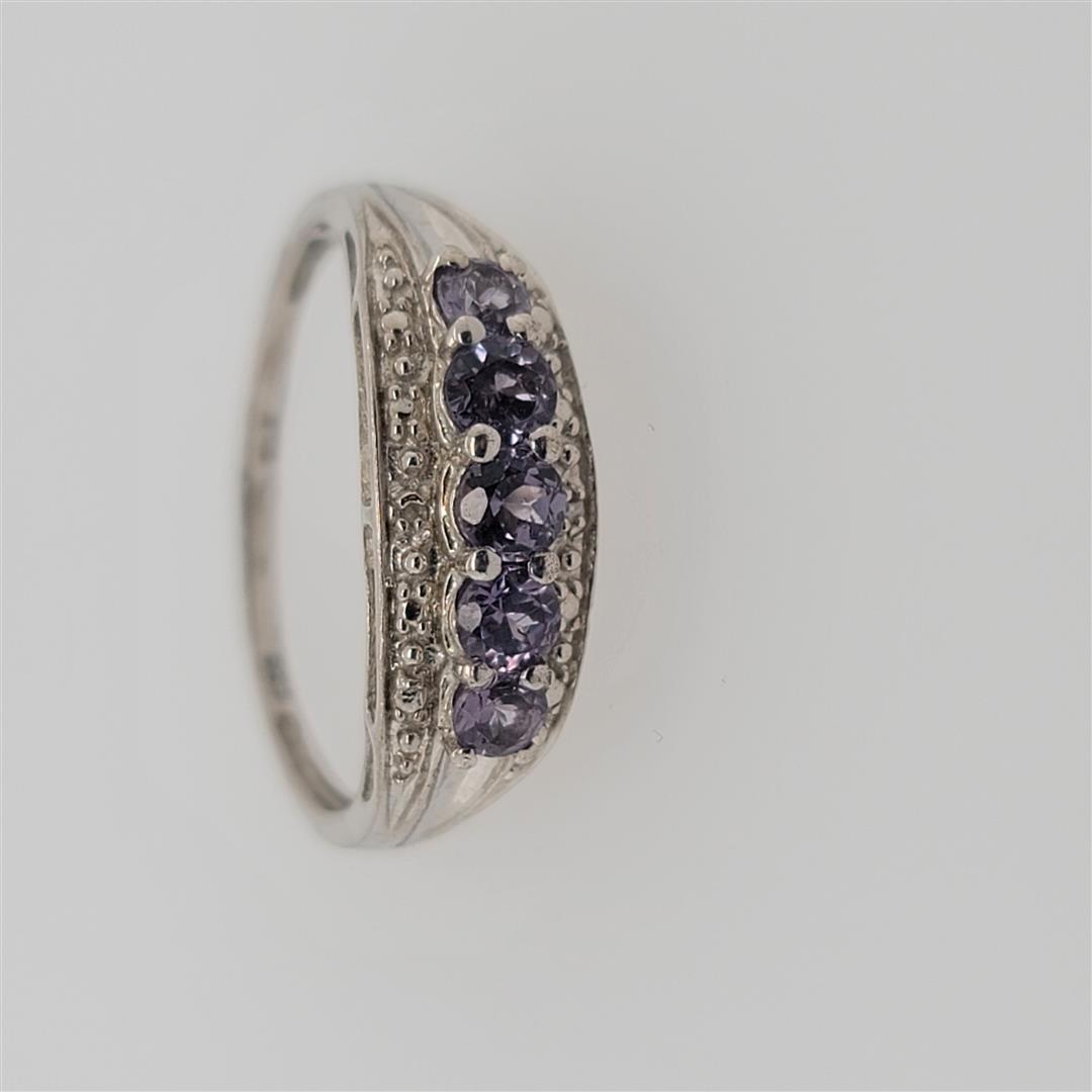 Sterling Silver Ring: One Sterling Silver Ring. The ring size is 10.25. Contains semiprecious stones.