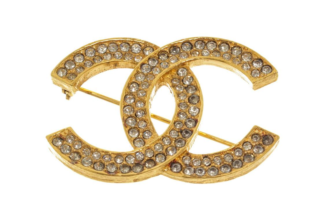 Chanel Gold CC Rhinestone Brooch: Chanel Gold CC Rhinestone Brooch. All available information is listed in the description and shown in the photos. Chanel gold CC rhinestone brooch with gold-tone hardware, CC logo with rhinestones, an