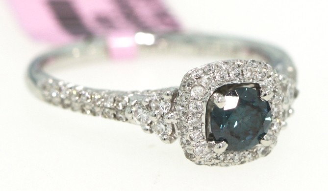 14KT White Gold .99ct Blue and White Diamond Ring FJM91: 14KT White Gold .99ct Blue and White Diamond Ring FJM913. Excellent Condition! SI828CE. One 14KT white gold blue and white diamond ring. Features one center blue diamond weighing 0.44cts surrounded by