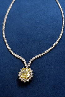 18KT White Gold 21.1ct Light Yellow Diamond Necklace A3: 18KT White Gold 21.1ct Light Yellow Diamond Necklace A3382. New Condition! AC90053XQ. One electronically tested 18KT white gold ladies cast and assembled diamond necklace. The featured yellow diamond