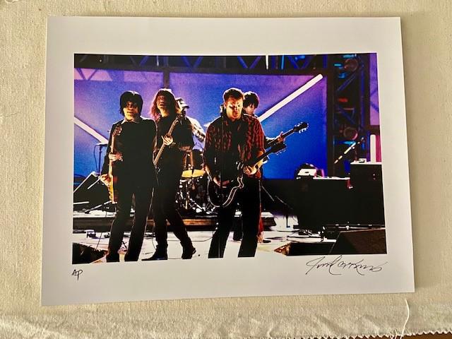 Neil Part and RUSH by Robert Knight: A stage shot of drummer Neil Part and the rock band "Rush", captured by famed photographer Robert Knight 14x11", signed & numbered