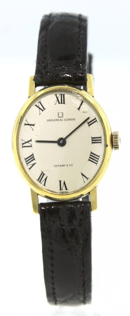 Ladies 18KT Gold Universal Geneve Wristwatch for Tiffan: Ladies 18KT Gold Universal Geneve Wristwatch for Tiffany and Co WBS103. Great Condition! IG109NH. One ladies, Universal Geneve wristwatch for Tiffany and Company, 18KT yellow gold electronically teste