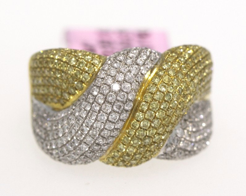 18KT Yellow Gold 1.73ct Yellow and White Diamond Ring F: 18KT Yellow Gold 1.73ct Yellow and White Diamond Ring FJM1194. Excellent Condition! LA1321GC. One 18KT yellow gold yellow and white diamond ring. Features 200 fancy yellow diamonds weighing a total of