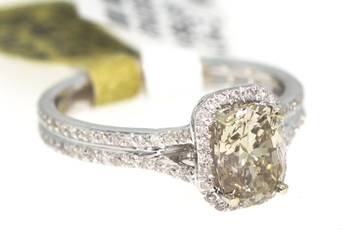 18KT White Gold 1.69ct Brown and White Diamond Ring RM3: 18KT White Gold 1.69ct Brown and White Diamond Ring RM355. New Condition! LF6891GH. One electronically tested 18KT white gold ladies cast and assembled diamond unity ring with a bright finish. Good wo
