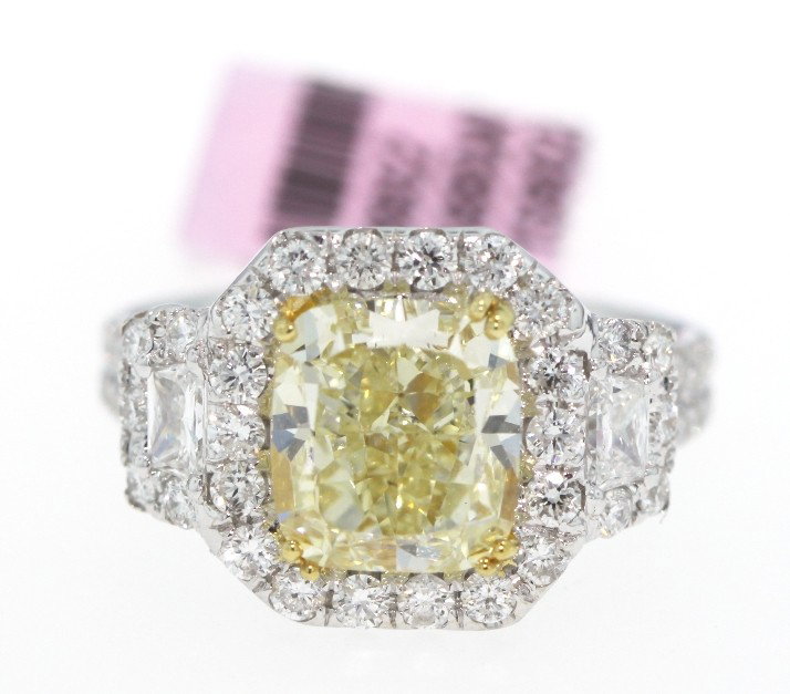 18KT White Gold 4.79ct Yellow and White Diamond Ring FJ: 18KT White Gold 4.79ct Yellow and White Diamond Ring FJM585. New Condition! QU43951FK. One electronically tested 18KT white gold ladies cast and assembled diamond ring. Good workmanship. The featured 