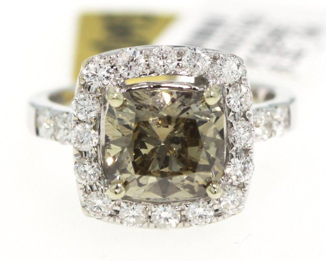14KT White Gold 4.12ct Brown and White Diamond Ring RM3: "14KT White Gold 4.12ct Brown and White Diamond Ring RM352. Great Condition! TD7866CN. One electronically tested 14KT white gold ladies cast diamond ring. Good workmanship. The featured diamond is set
