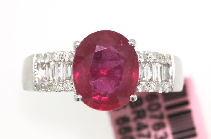 18KT White Gold 4.25ct Ruby and Diamond Ring FJM1408: 18KT White Gold 4.25ct Ruby and Diamond Ring. Excellent Condition! XU166WG. This beautiful 18KT White Gold Semi-Mount Wedding Ring features (1) Ruby(s) weighing approximately 4.25cts and (0.36) Baguet