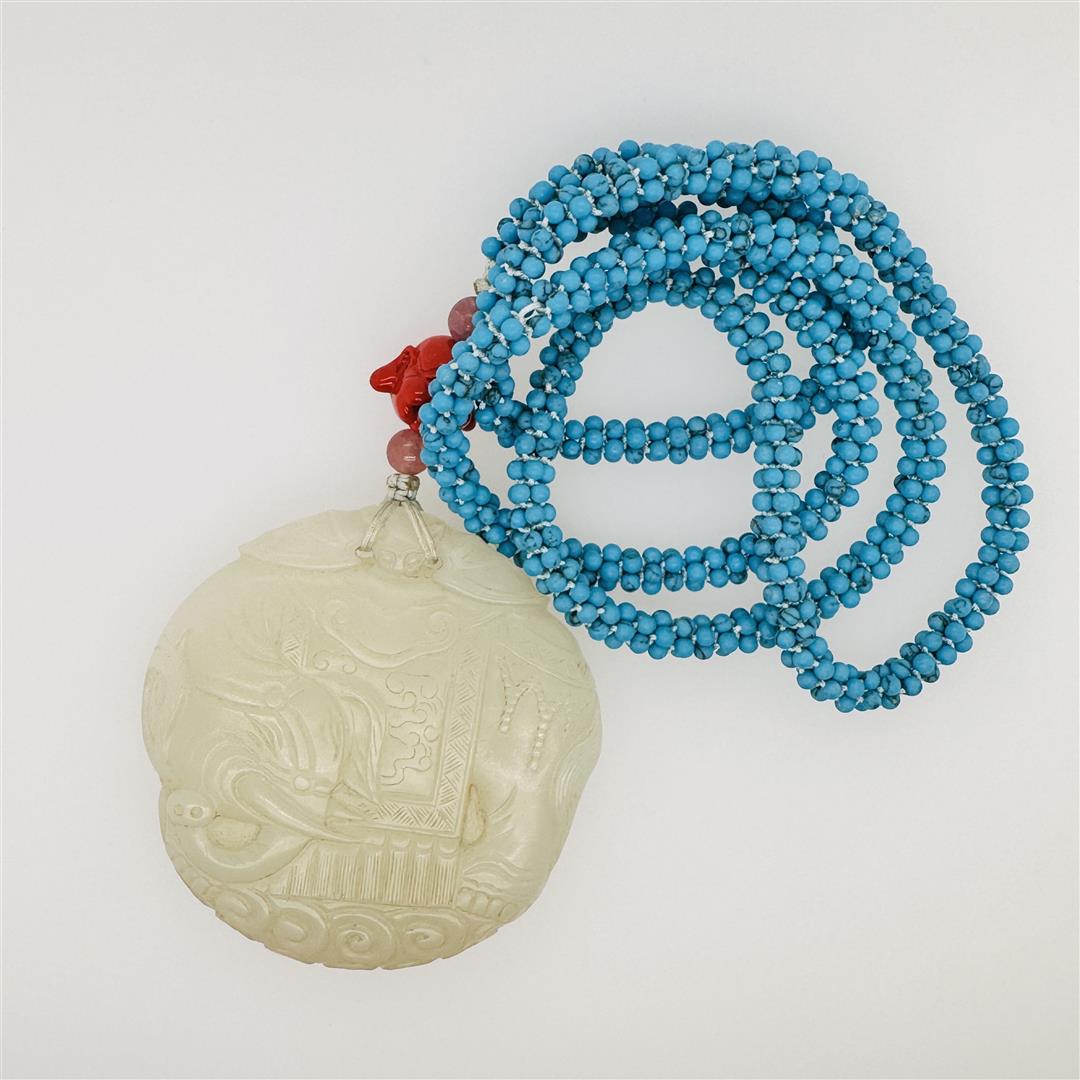 Antique Chinese Jade Toggle & Turquoise Necklace: Antique Chinese, Qing Dynasty mutton fat carved Da Xing jade pei of elephant design, mounted on later turquoise bead necklace with pink tourmaline beads and glass Buddha head accents; gross weight 69.