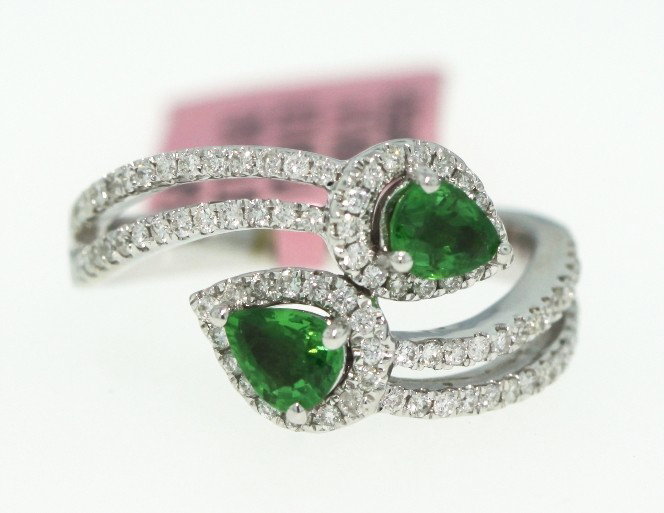 18KT White Gold .76ct Tsavorite and Diamond Ring FJM721: "18KT White Gold .76ct Tsavorite and Diamond Ring FJM721. Excellent Condition! QU196TL. One 18KT white gold H. Emperor tsavorite and diamond ring. Features two tsavorite gems weighing a total of 0.76c