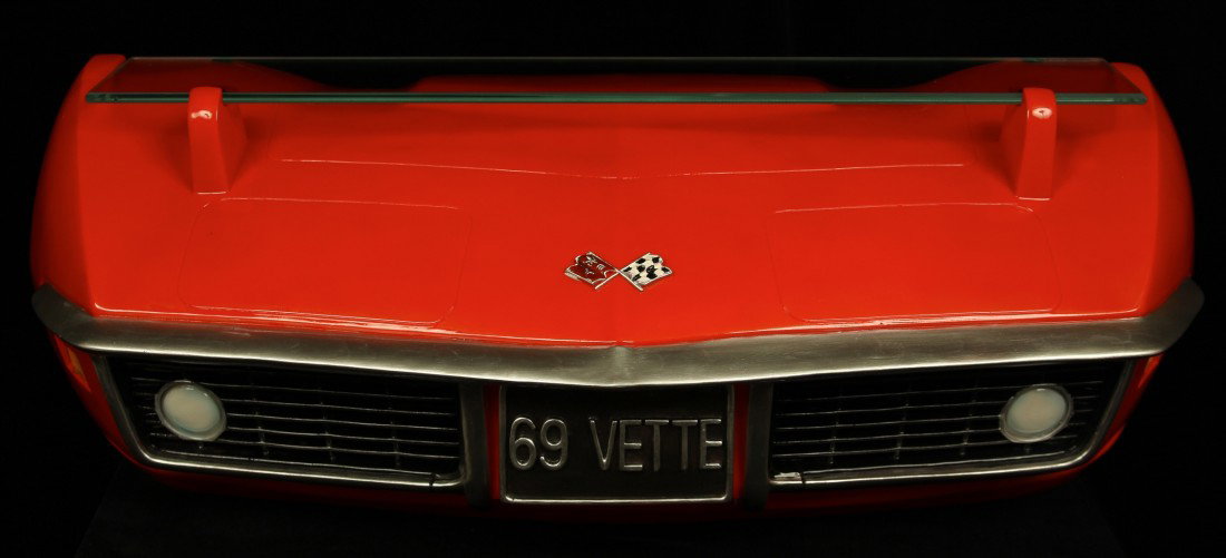 69' Corvette Front End 3D Hanging Shelf GM5: 69' Corvette Front End 3D Hanging Shelf GM5. Excellent Condition! MS15DZ. One hanging tempered glass shelf supported by a hand painted red 3D 1969 Chevrolet Corvette front end. Dimensions: 21 length X