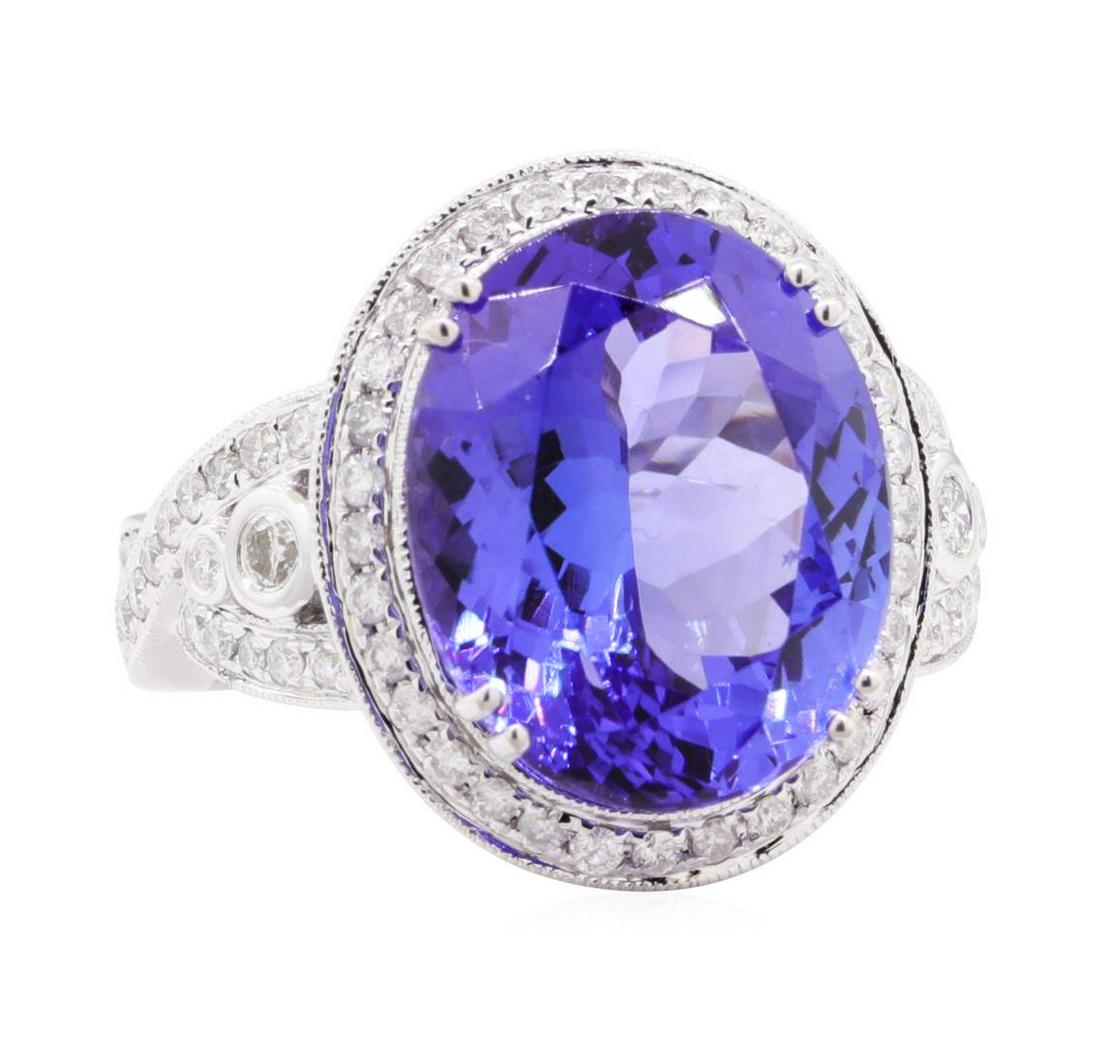 12.53 ctw Tanzanite and Diamond Ring - 14KT White Gold: One electronically tested 14KT white gold lady's cast fashion ring with a cathedral halo with a bright polish with milgrain detailing finish. The featured lady's ring has a shank measuring 3.30 millim