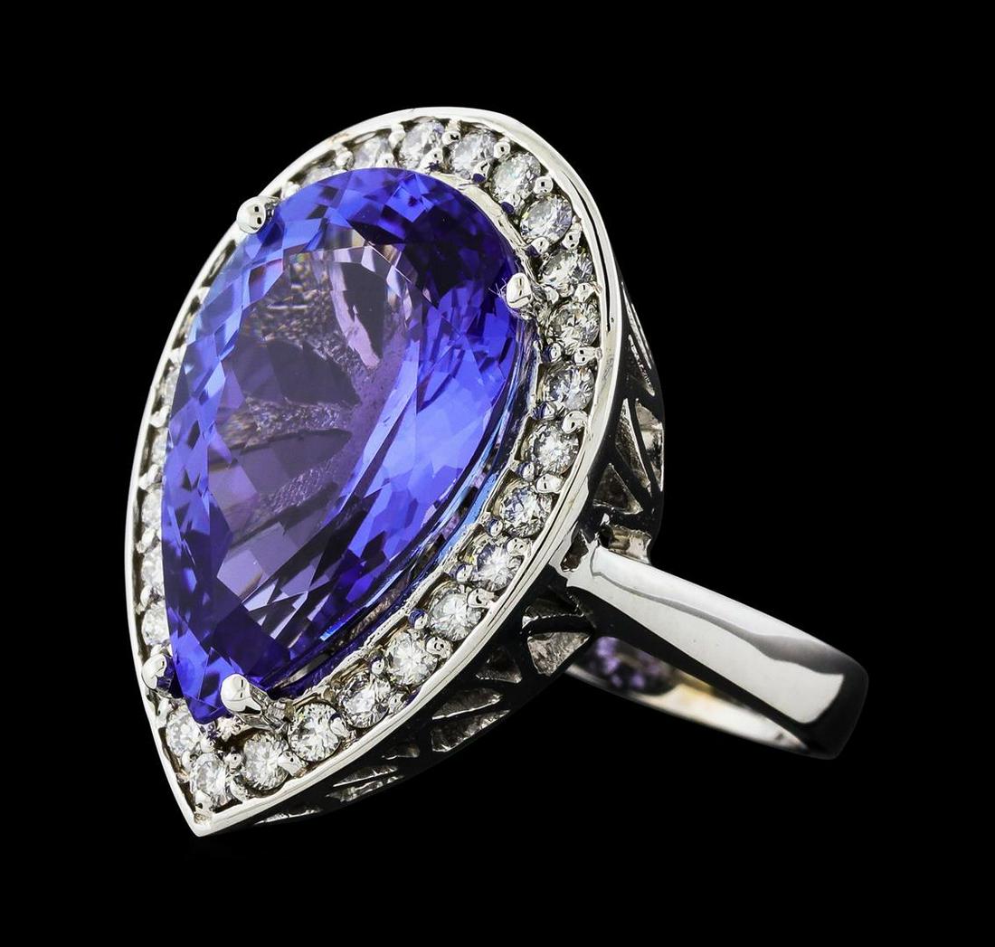 GIA Cert 11.93 ctw Tanzanite and Diamond Ring - 14KT White Gold: One electronically tested 14KT white gold lady's cast fashion ring with a basket halo with a bright polish finish. The featured lady's ring has a shank measuring 3.05 millimeters wide. Identified with