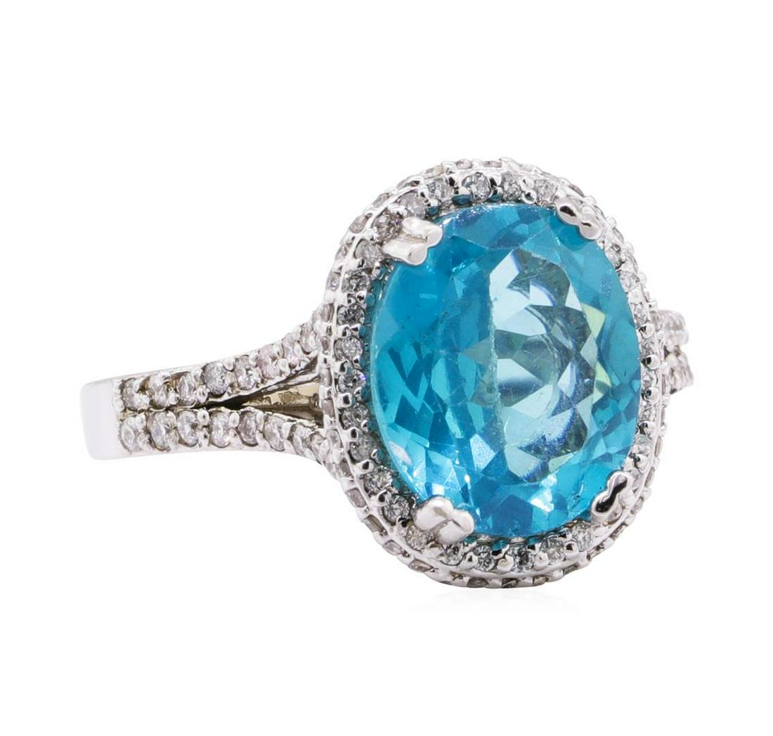 4.16 ctw Apatite And Diamond Ring - 14KT White Gold: One electronically tested 14KT white gold lady's cast fashion ring with a split cathedral shank with a bright polish finish. The featured lady's ring has a shank measuring 2.30 millimeters wide. Ident